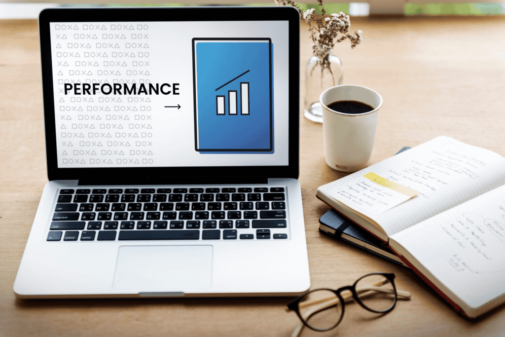 performance analysis on the laptop screen with notebook on the right