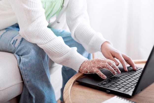 human with white sweater sitting at the table and typing on the laptop